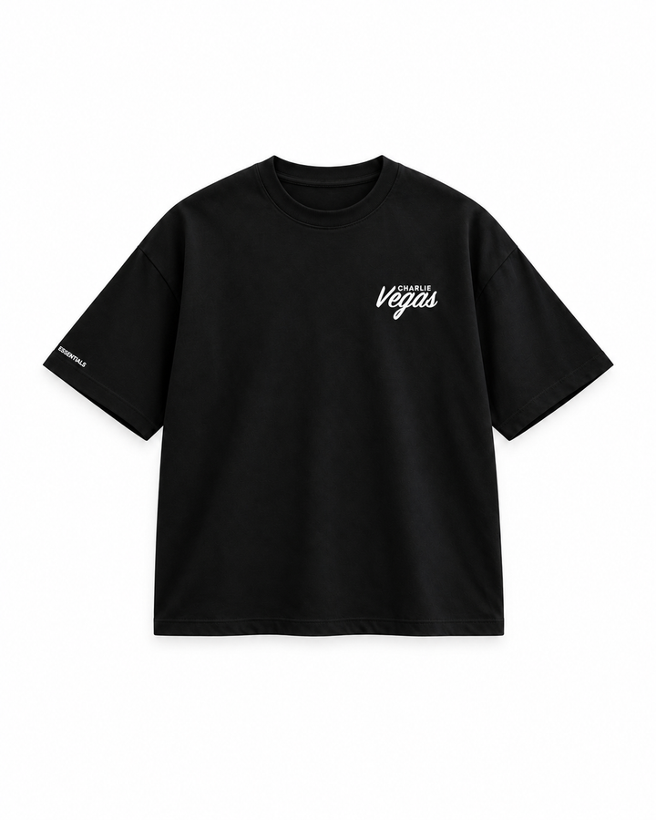 Signature Tee in black, flat lay with Vegas chest logo
