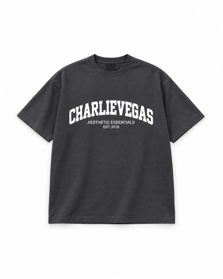 Varsity Tee V2 in charcoal with white CHARLIEVEGAS print, flat lay