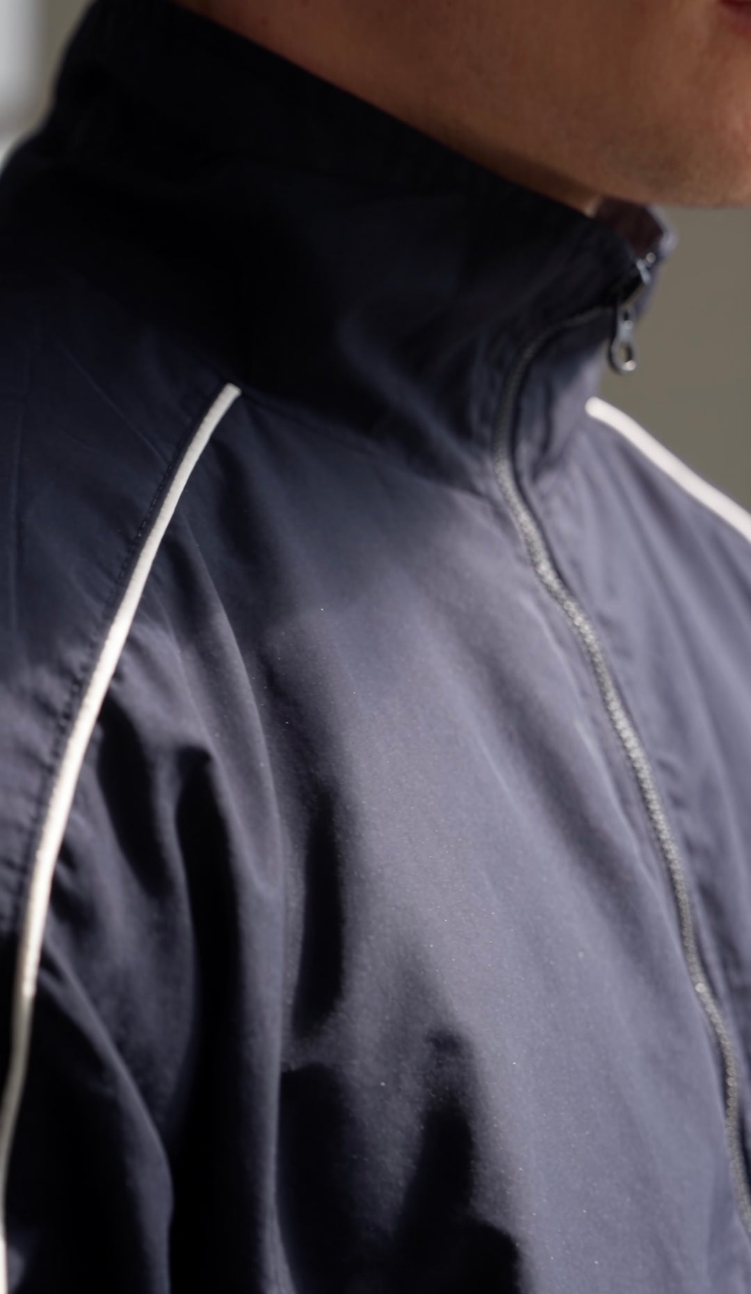 Close-up of the navy Aesthetics Club Jacket&