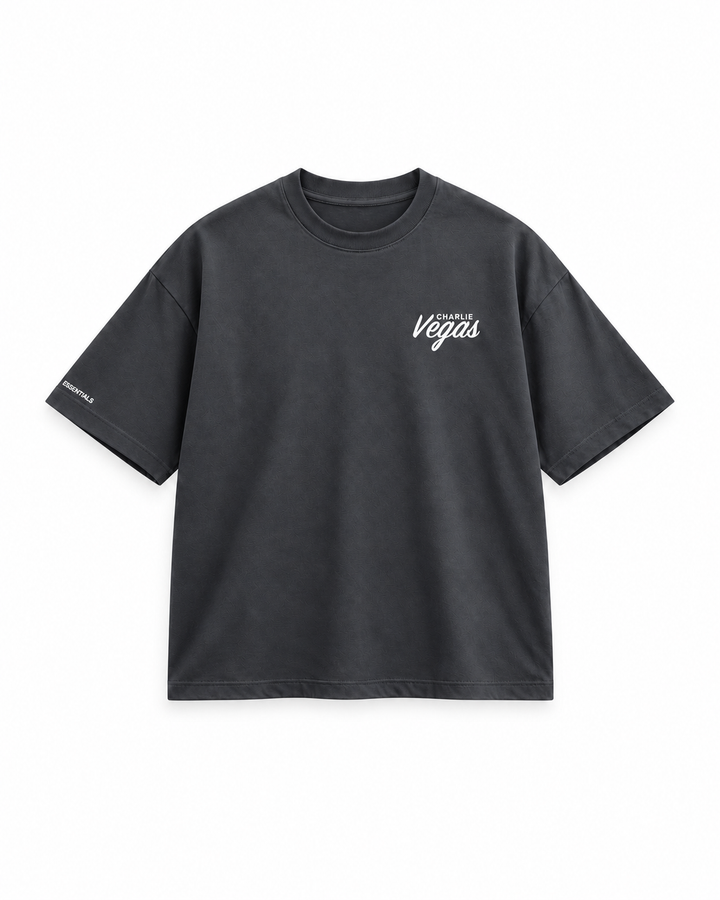 Signature Tee in charcoal, flat lay with Vegas chest logo